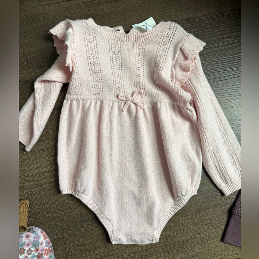 Adorable Pink Knit Baby Bodysuit with Ruffle Sleeves